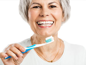 elderly women practing mouth care