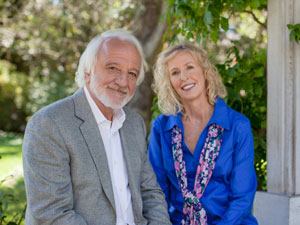 elderly man outside with daughter caregiver